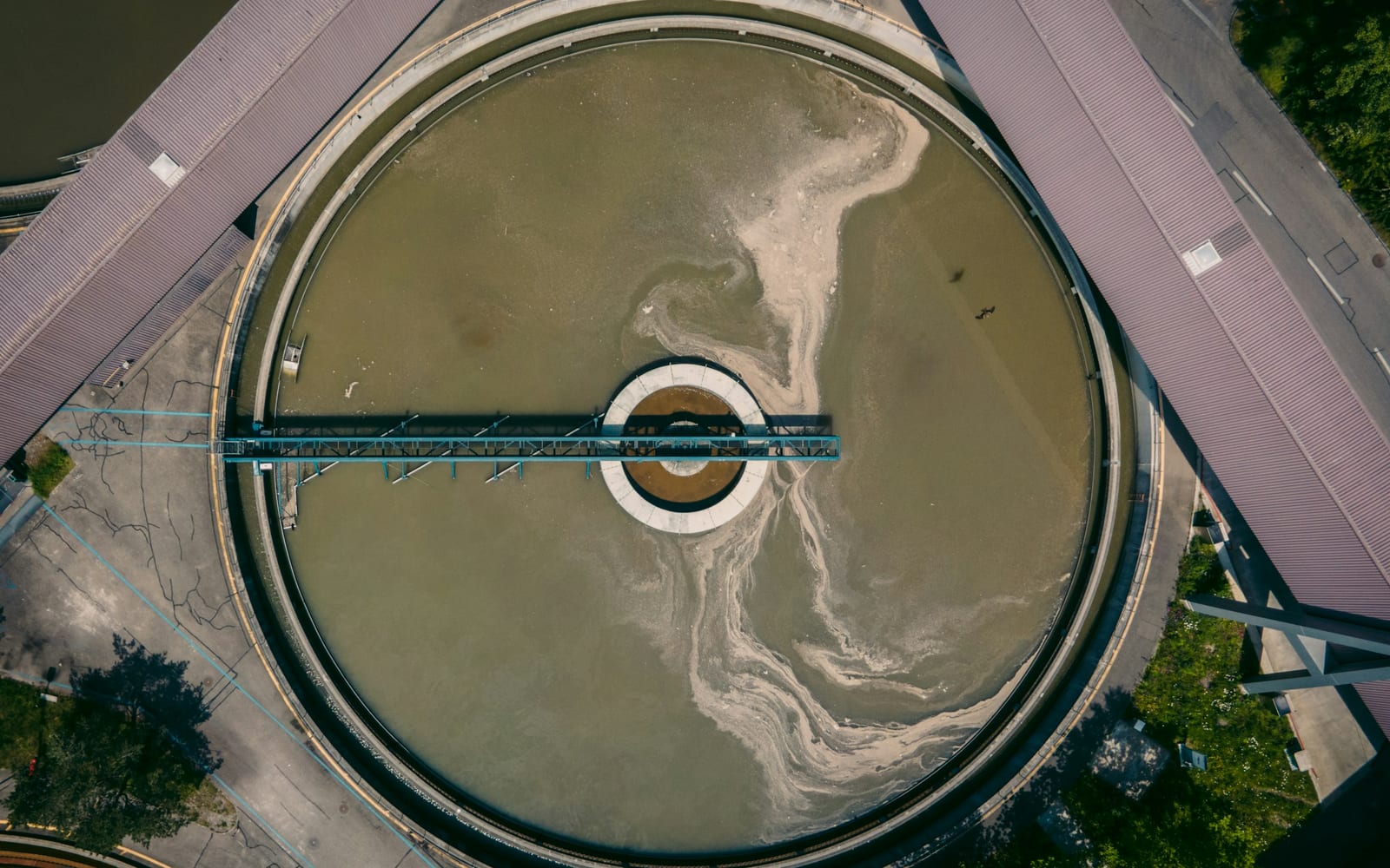Concrete water treatment structure photographed in cool daylight.